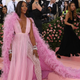 Illustration for article titled Naomi Campbell brought a guy to the Met Gala just to fan her dress